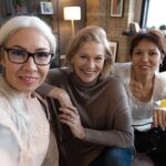 Happy old friends sitting at home